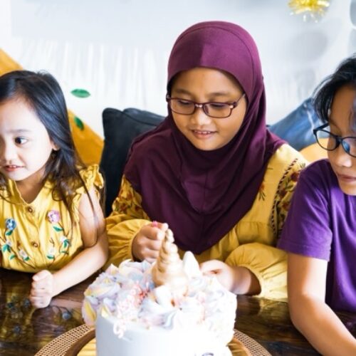 three-asian-siblings-celebrating-birthday-at-home-2025-03-10-05-51-00-utc-Medium